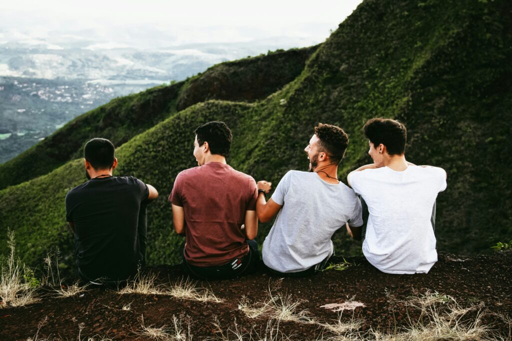 4 friends sitting together on the mountains, This shows the great Love between them